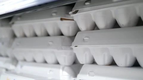 Egg cartons standing in a row on top of each other. Stock Footage 311889596