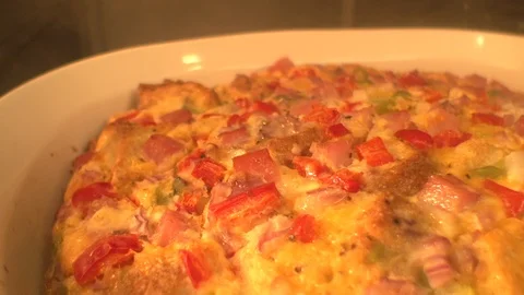 Egg casserole. Quiche. Steaming hot out of oven. cu Stock Footage 101713026