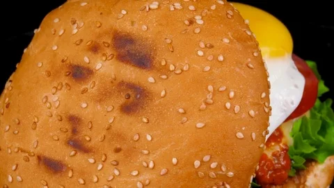 Egg Cheese Burger with fresh vegetables, close-up view Stock Footage 84652937