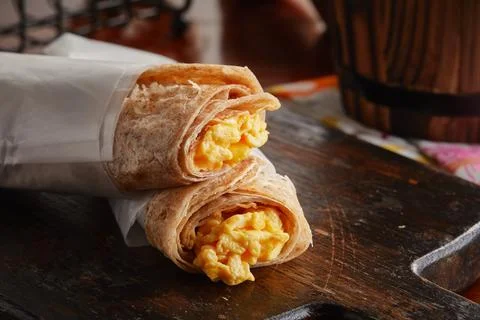 Egg Cheese Chapati Scrambled roll served in a dish isolated on wooden backgro Foto stock