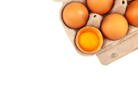 Egg Chicken eggs. Top view of an open gray box with brown eggs Isolated on a Stock Photos