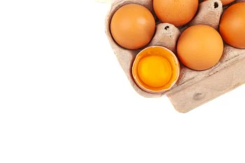Egg Chicken eggs. Top view of an open gray box with brown eggs Isolated on a Stock Photos