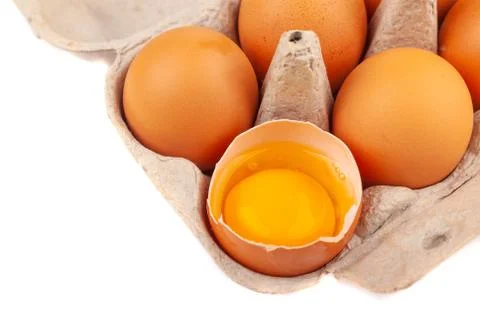 Egg Chicken eggs. Top view of an open gray box with brown eggs Isolated on a Stock Photos
