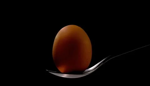 Egg close up on the spoon Stock Photos