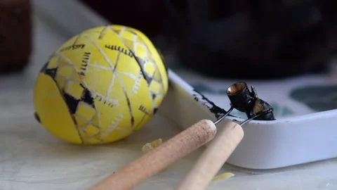 Egg in color patterns in the hand. multi-colored. painting eggs Video stock 127957503