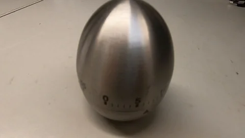 Egg cook timer on a table Stock Footage 97010410