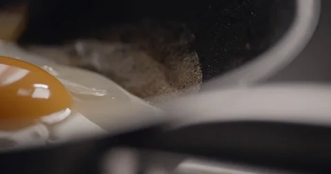 Egg cooking slowmotion close up ‚Äì SOURCE: 4K 120 FPS PRORES 4444 12 BITS Stock Footage 73152594