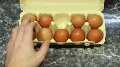 Egg counting for breakfast, cooking eggs Stock Footage 266989653