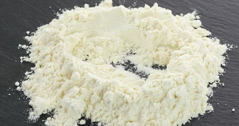 Egg crack in to the flour Stock Footage 102357365