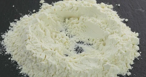 Egg crack in to the flour Stock Footage 102357467