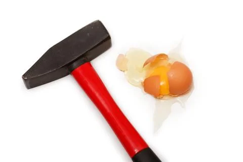 Egg cracked with hammer Stock Photos