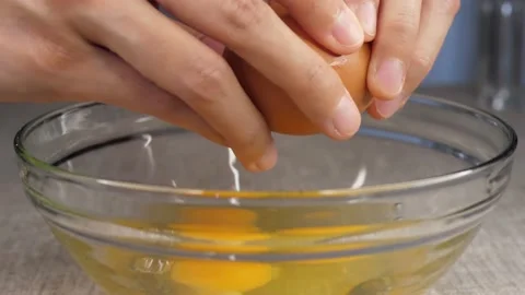 Egg cracking into a bowl Stock Footage 169769804