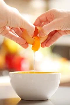 Egg cracking Stock Photos