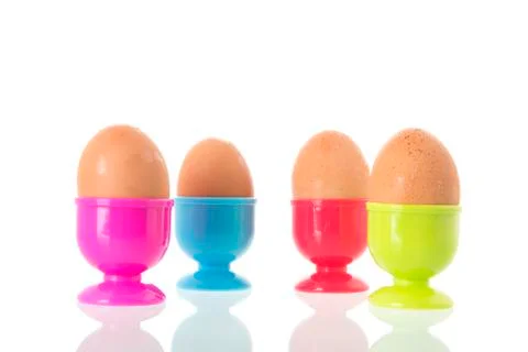 Egg cups with eggs Stock Photos