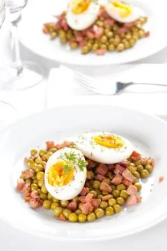 Egg dish with ham and peas Stock Photos