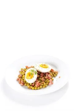 Egg dish with ham and peas Stock Photos