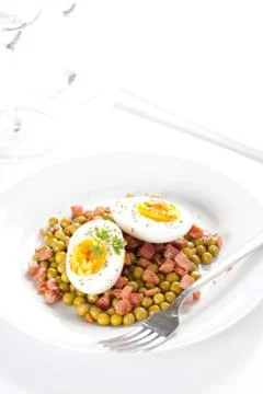 Egg dish with ham and peas Stock Photos