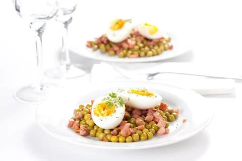 Egg dish with ham and peas Stock Photos