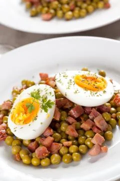 Egg dish with ham and peas Stock Photos