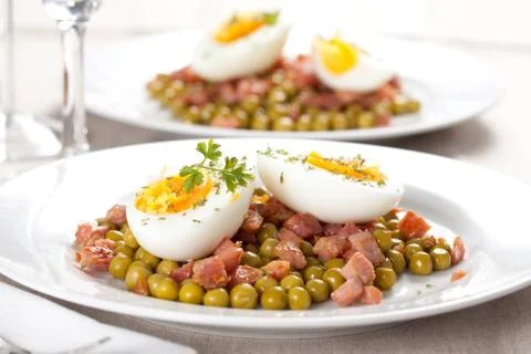 Egg dish with ham and peas Stock Photos