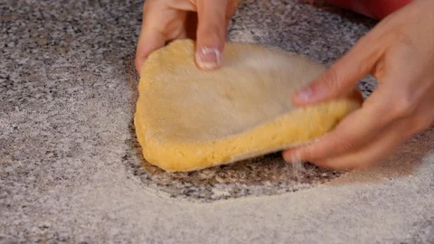 Egg dough rolled out with a rolling pin Stock Footage 97940918