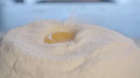Egg Dropping Into Flour, Slow Motion. Stock Footage 60928272