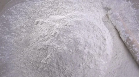 Egg dropping into flour, slow motion. lour Products. Bakery products Stock Footage 67244345