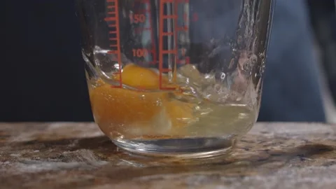 Egg dropping slow motion Stock Footage 149944902