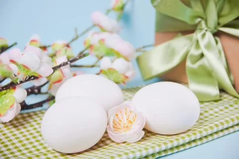 Egg for Easter day, gift box and cherry blossom branch Foto stock