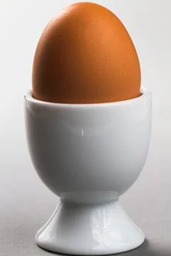 Egg with eggcup Stock Photos