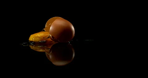 Egg falling and breaking open Stock Footage 154236027
