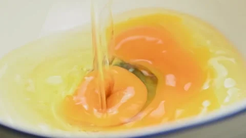 Egg falling in a bowl. Process of making omelet. Stock Footage 168146084