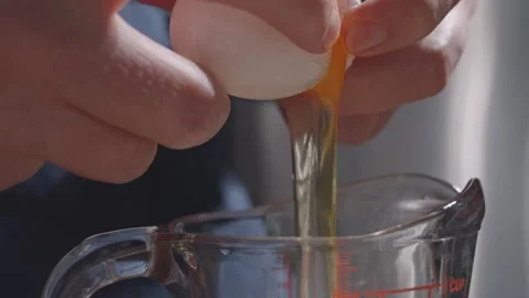 Egg falling slow motion Stock Footage 149944921