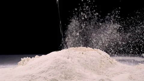 Egg falling in white flour in slow motion Stock Footage 81180720
