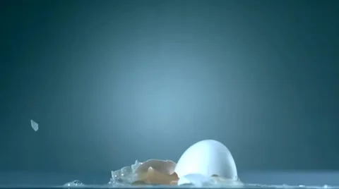 Egg falls down in slow motion and smashs - 01 - High Speed 1050fps Stock Footage 11611979