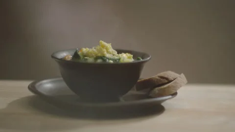 Egg falls into the finished borsch soup macro Stock Footage 200937771
