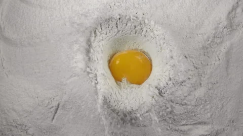 Egg falls into the flour, 480 fps slow motion Stock Footage 86940152