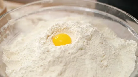 Egg Falls Into Flour Container Stock-Footage 273500327