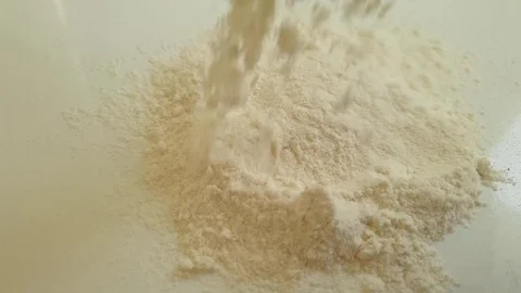Egg falls into flour, slow motion Stock Footage 113268817