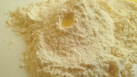 Egg falls into flour, slow motion Stock Footage 115826786