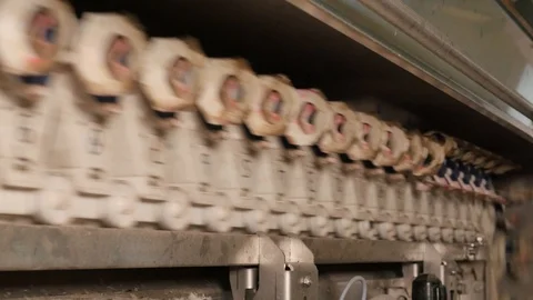 Egg filling machine brings back containers to conveyor belt Stock Footage