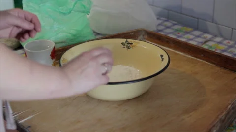 Egg in flour Stock Footage 65787281