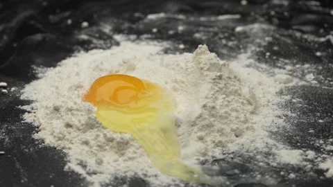 Egg In Flour Stock Footage 154758129