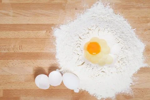 Egg in flour Stock Photos