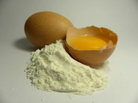 Egg with flour Stock Photos