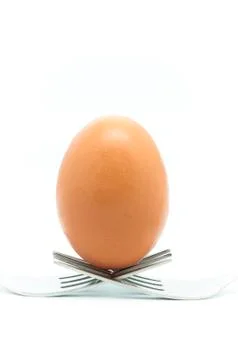 Egg with forks Stock Photos