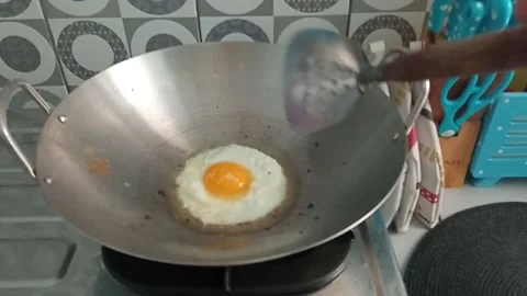 Egg fried flip process on the pan Stock Footage 153581259