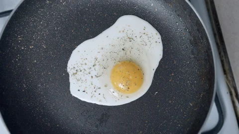 Egg is fried in a pan, camera movement Stock Footage 155552956