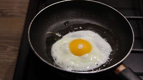 Egg fried in a pan Stock Footage 126934802