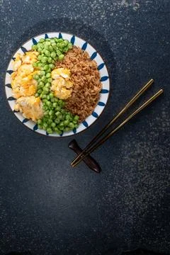 Egg fried rice and bean in plate on slate table. Stock Photos